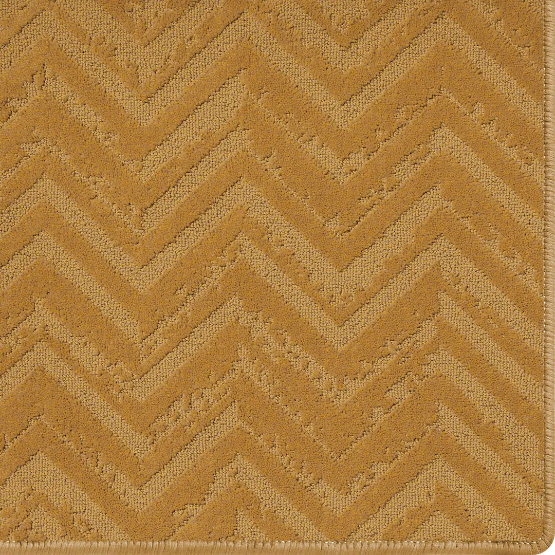 Woven Bliss – bronze orange rug with relic pattern and overlocked edges