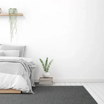 Woven Bliss – Amalfi Ambience Rug dark grey loop pile custom size rug in a bedroom