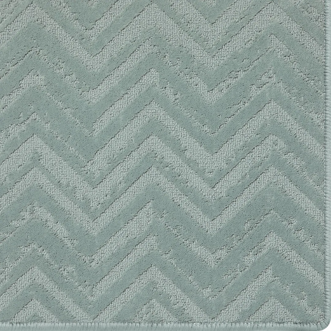 Woven Bliss – Blue metal rug with relic pattern and overlocked edges