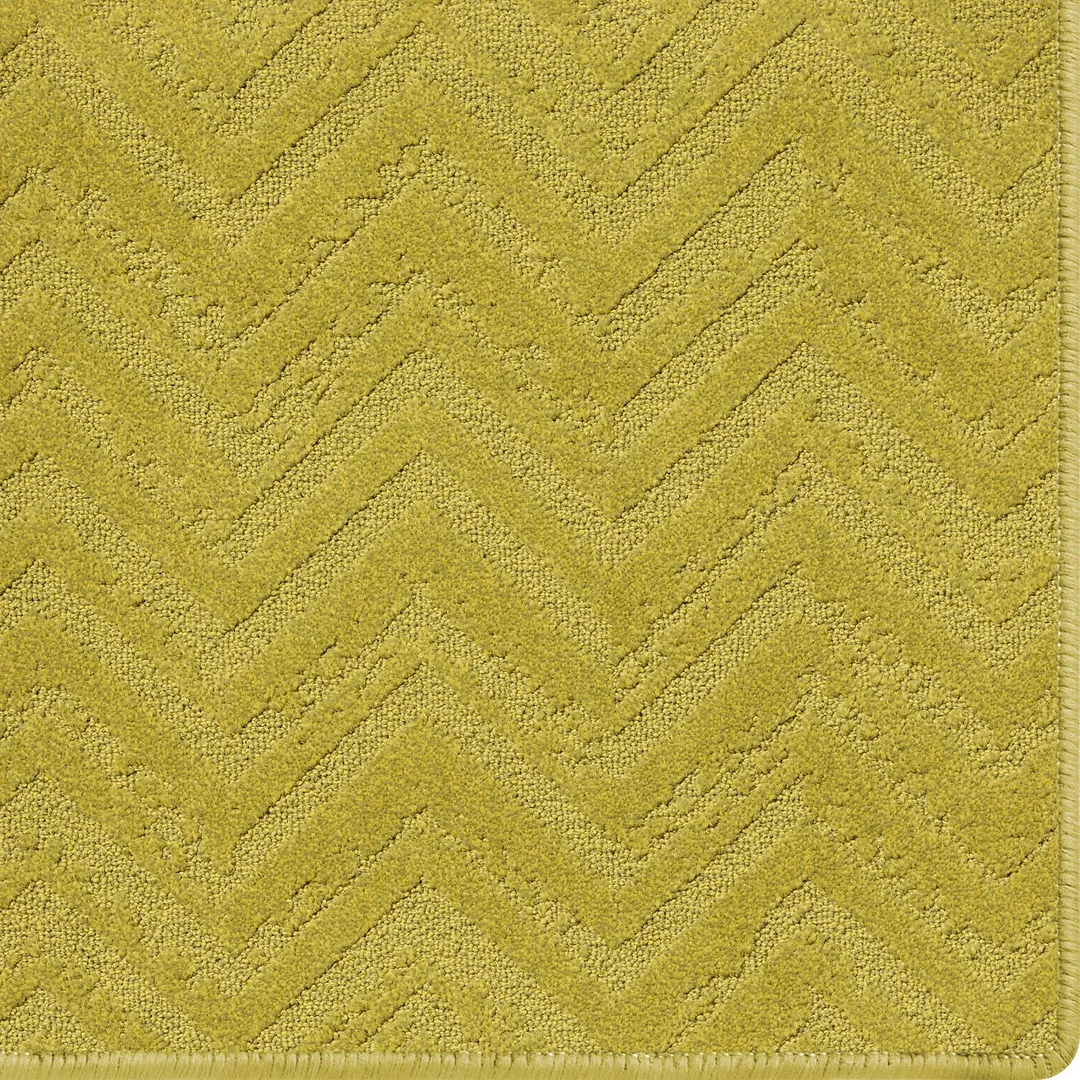 Woven Bliss – mustard rug with relic pattern and overlocked edges
