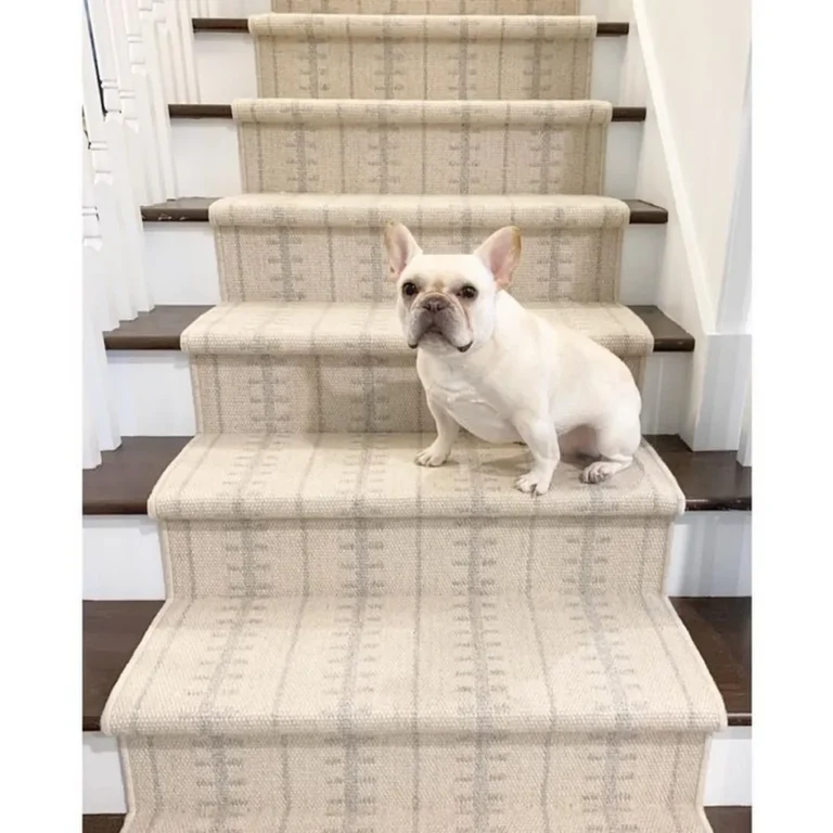 Woven Bliss – french bulldog sitting on stairs with cream runner