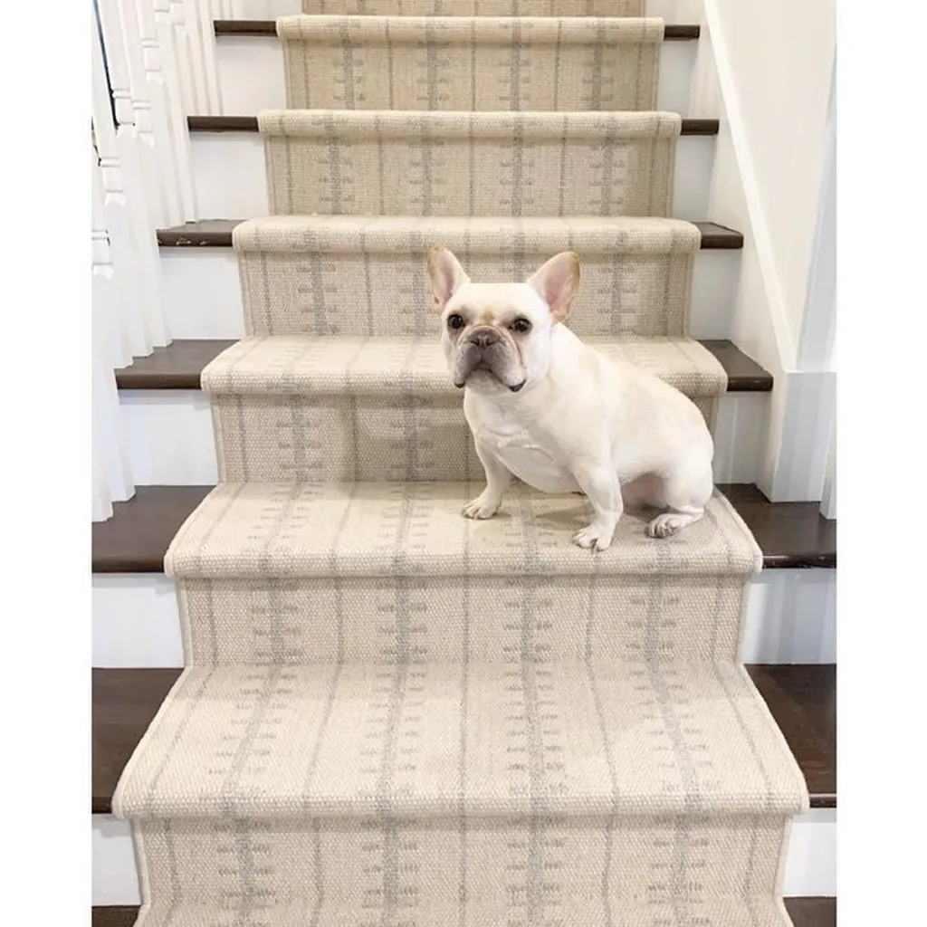 Woven Bliss – french bulldog sitting on stairs with cream runner