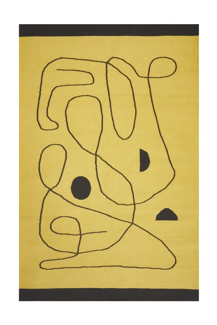 Woven Bliss – Village Citrus Rug with abstract black lines on it