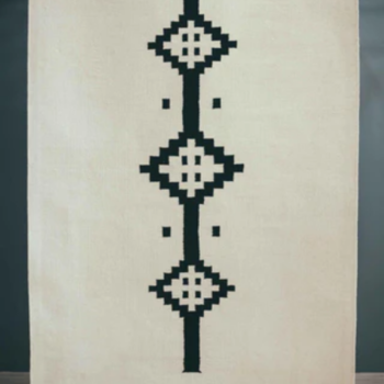 Woven Bliss – Karoo Rug a white and black rug
