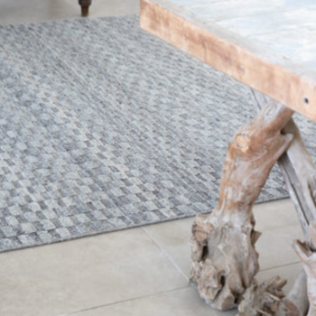 Woven Bliss – Stone rug with drift wood