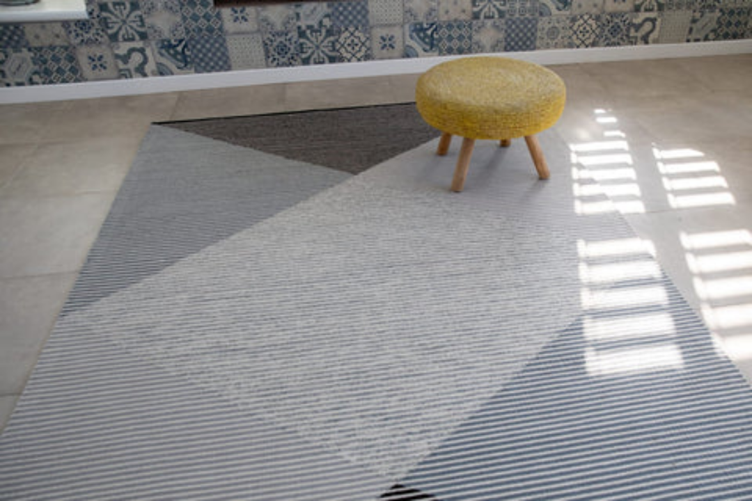 Woven Bliss – geometric pattern rug with solid lines going through it. Thula Rug