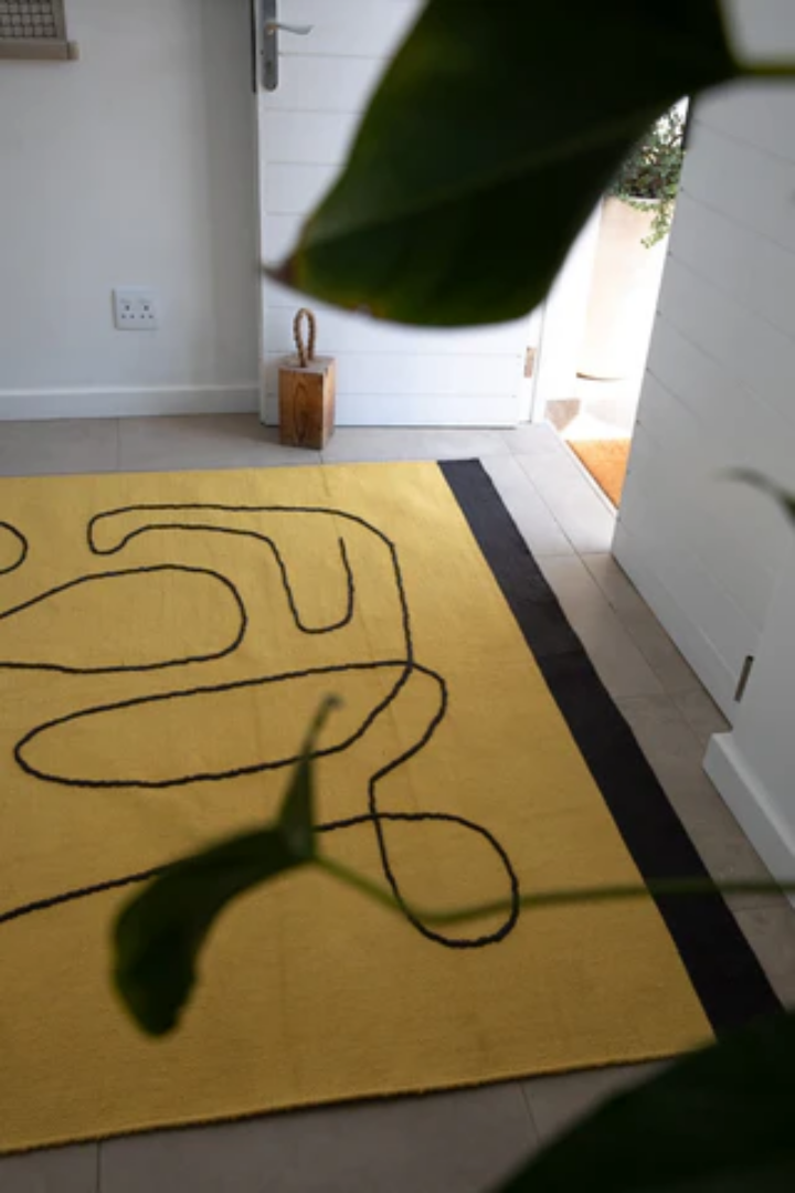 Woven Bliss – Yellow rug in home entrance